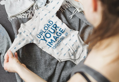 Mockup of a Woman Holding a Sublimated Onesie 37338-r-el2