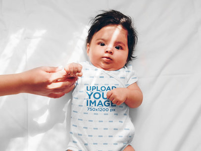 Sublimated Onesie Mockup of a Baby Holding His Parent's Finger 35481-r-el2
