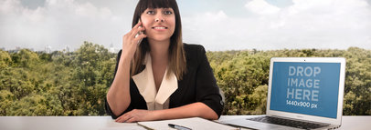 Product Mockup of a Macbook Air Featuring a Woman 