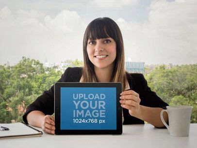Business Woman Using An iPad At The Office Frontal Shot