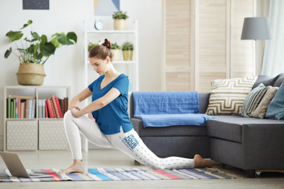 Side-View Leggings Mockup of a Woman Doing a Yoga Class at Home