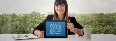 Business Woman Using An iPad At The Office Frontal Shot Wide