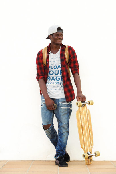 T-Shirt Mockup of a Man Casually Holding a Longboard 38925-r-el2