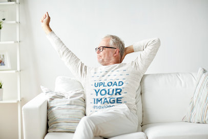 Mockup of a Senior Man with a Heather Sweatshirt Stretching in the Living Room 39132-r-el2