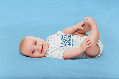 Mockup of a Cute Baby Boy Wearing a Sublimated Onesie