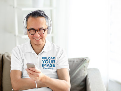 Polo Shirt Mockup Featuring an Elderly Man with Headphones 39134-r-el2