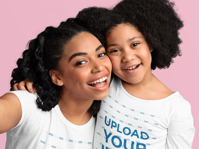 T-Shirt and Long-Sleeve Tee Mockup Featuring Mother and Daughter Taking a Selfie