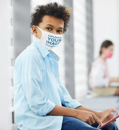 Face Mask Mockup of a Boy Using a Tablet