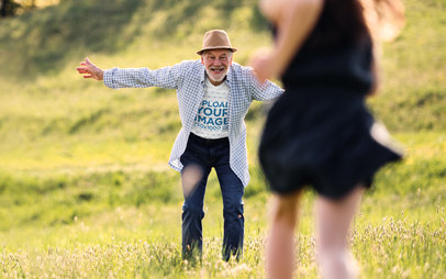 T-Shirt Mockup of a Joyful Senior Man Waiting for Her Granddaughter with Arms Wide Open 39035-r-el2