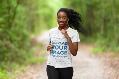T-Shirt Mockup of a Female Runner Surrounded by Nature
