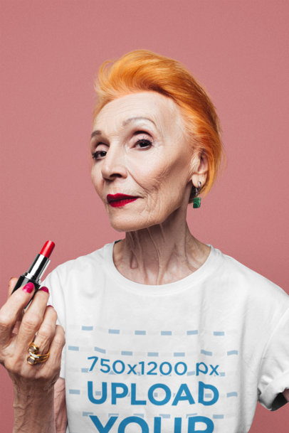 T-Shirt Mockup of a Senior Woman Holding a Lipstick 