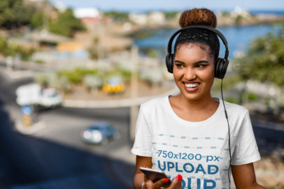 T-Shirt Mockup of a Happy Woman Listening to Music with a Pair of Headphones 36397-r-el2