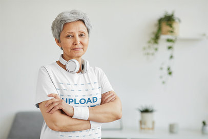 T-Shirt Mockup of a Senior Woman Posing at Home