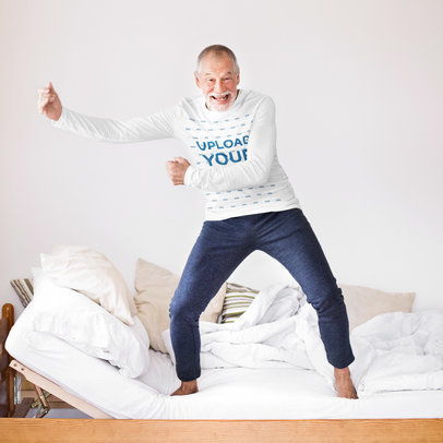 Long Sleeve Tee Mockup Featuring a Senior Man Standing on a Bed