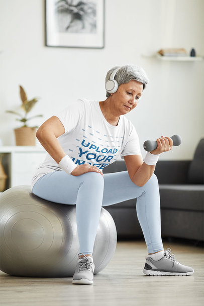 T-Shirt Mockup of a Senior Woman Doing Strength Training 39636-r-el2
