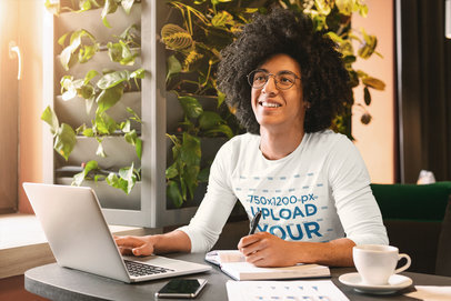 Mockup of a Young Man Wearing a Long Sleeve Tee at the Living Room