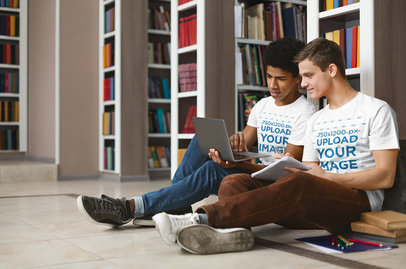 T-Shirt Mockup Featuring Two Students Reading in a Library