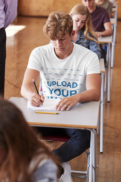 T-Shirt Mockup of a Student Taking a Test at College