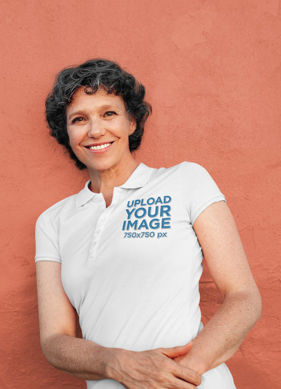 Polo Shirt Mockup of a Senior Woman Leaning on a Wall
