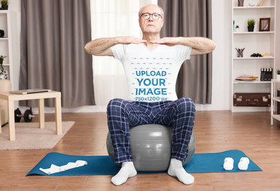 V-Neck Tee Mockup of a Senior Man Doing Pilates at Home