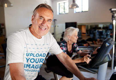 T-Shirt Mockup of a Middle-Aged Man Doing Cardio at the Gym