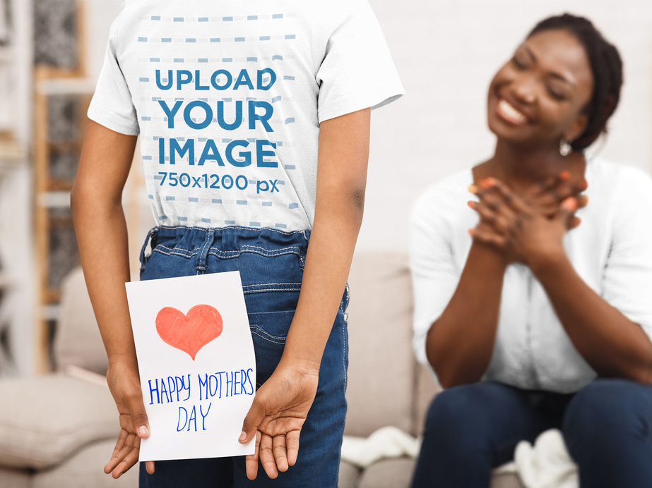 T-Shirt Mockup of a Girl Hiding a Present for Her Mom in Her Back