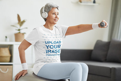 T-Shirt Mockup of a Senior Woman Working Out at Home