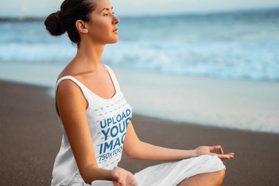 Tank Top Mockup Featuring a Woman Meditating Near the Ocean