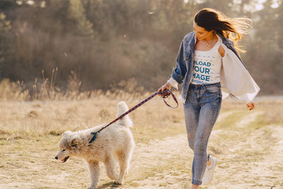 Mockup of a Woman with a Tank Top Walking in Nature with a Dog 39429-r-el2