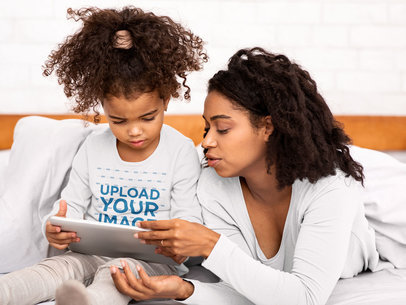 Long Sleeve Tee Mockup of a Curly-Haired Little Girl Using a Tablet with Her Mom 39240-r-el2