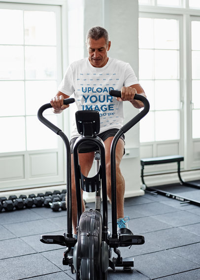 Mockup of a Senior Man Wearing a Customizable T-Shirt at the Gym 