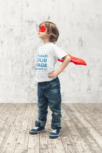T-Shirt Mockup of a Kid Posing Like a Superhero