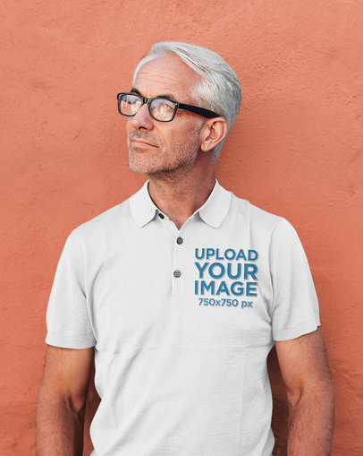 Polo Shirt Mockup of a Senior Man Against a Plain Wall