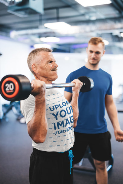 Heather T-Shirt Mockup of a Senior Man Lifting Weights