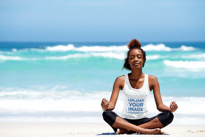 Tank Top Mockup of a Woman Doing Meditation at the Beach