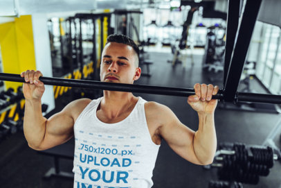 Tank Top Mockup of a Muscular Man Doing Pull Ups at the Gym