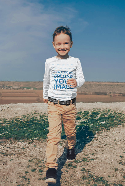 Long-Sleeve Tee Mockup Featuring a Boy Walking Outside 
