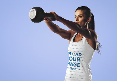 Tank Top Mockup of a Woman Swinging a Kettlebell
