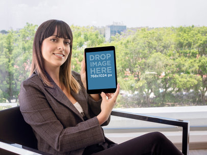 Business Woman Showcasing An iPad At The Office