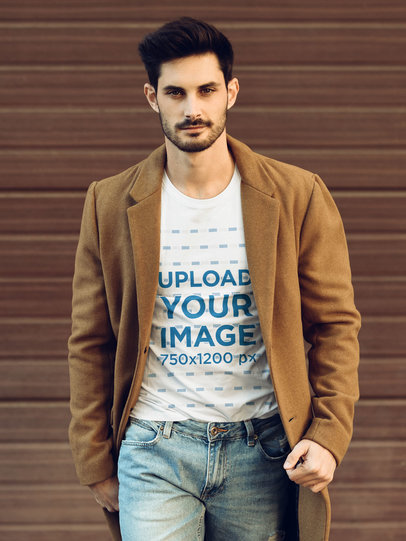 T-Shirt Mockup of a Man Walking on the Street on a Cold Day