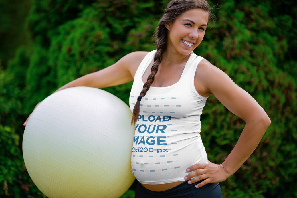 Tank Top Mockup of a Pregnant Woman Holding an Exercise Ball 
