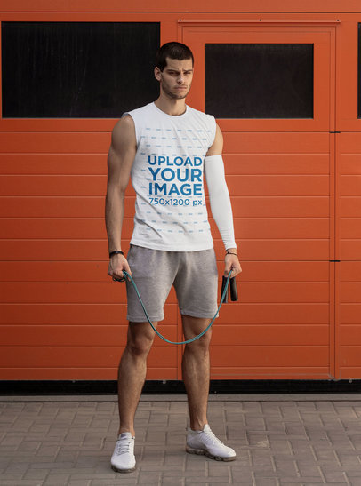 Mockup of a Muscular Man Wearing an Activewear Sleeveless Shirt