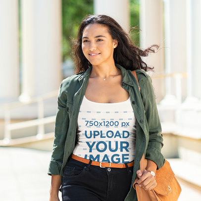 Tank Top Mockup of a Woman Walking on the Street on a Windy Day
