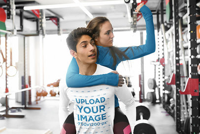 Long-Sleeve Tee Mockup of a Man Carrying a Friend at a Gym 