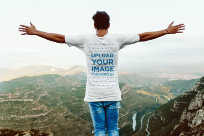 Back-View T-Shirt Mockup of a Man on Top of a Mountain