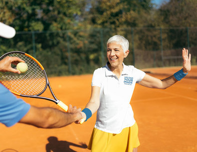Polo Shirt Mockup of a Senior Woman Learning Tennis