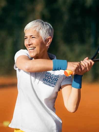 Polo Shirt Mockup of a Senior Woman Playing Tennis