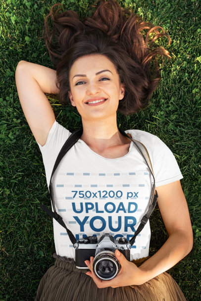 T-Shirt Mockup of a Happy Woman Lying on the Grass 38025-r-el2