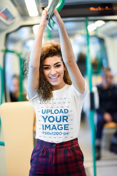 T-Shirt Mockup of a Happy Woman Smiling in the Subway