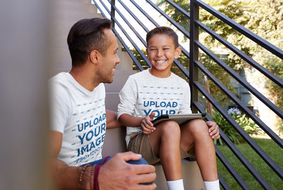 T-Shirt and Long Sleeve Tee Mockup of a Happy Kid Sitting on a Staircase With His Dad
